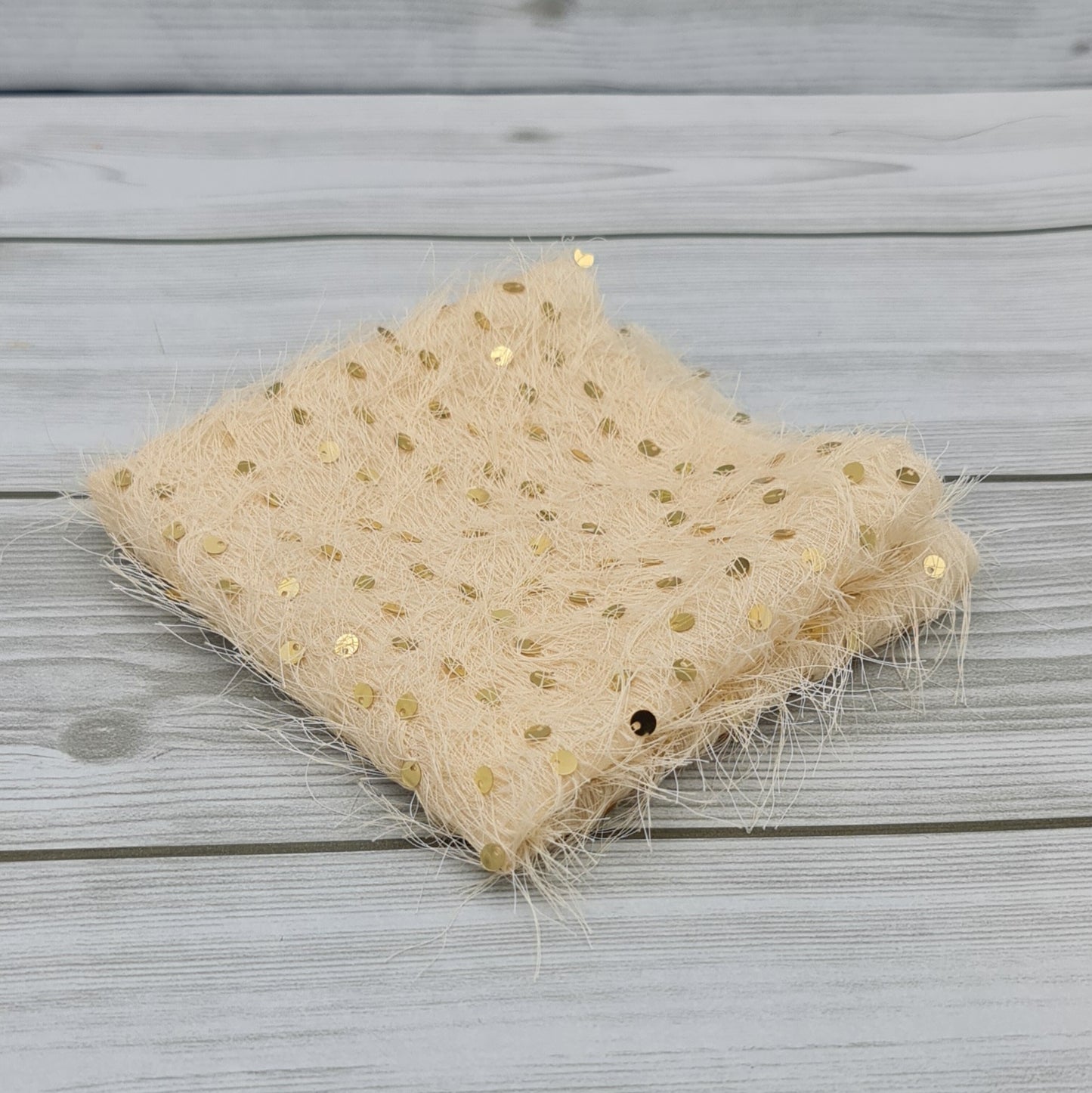 Tessuto Peloso con Paillettes Oro