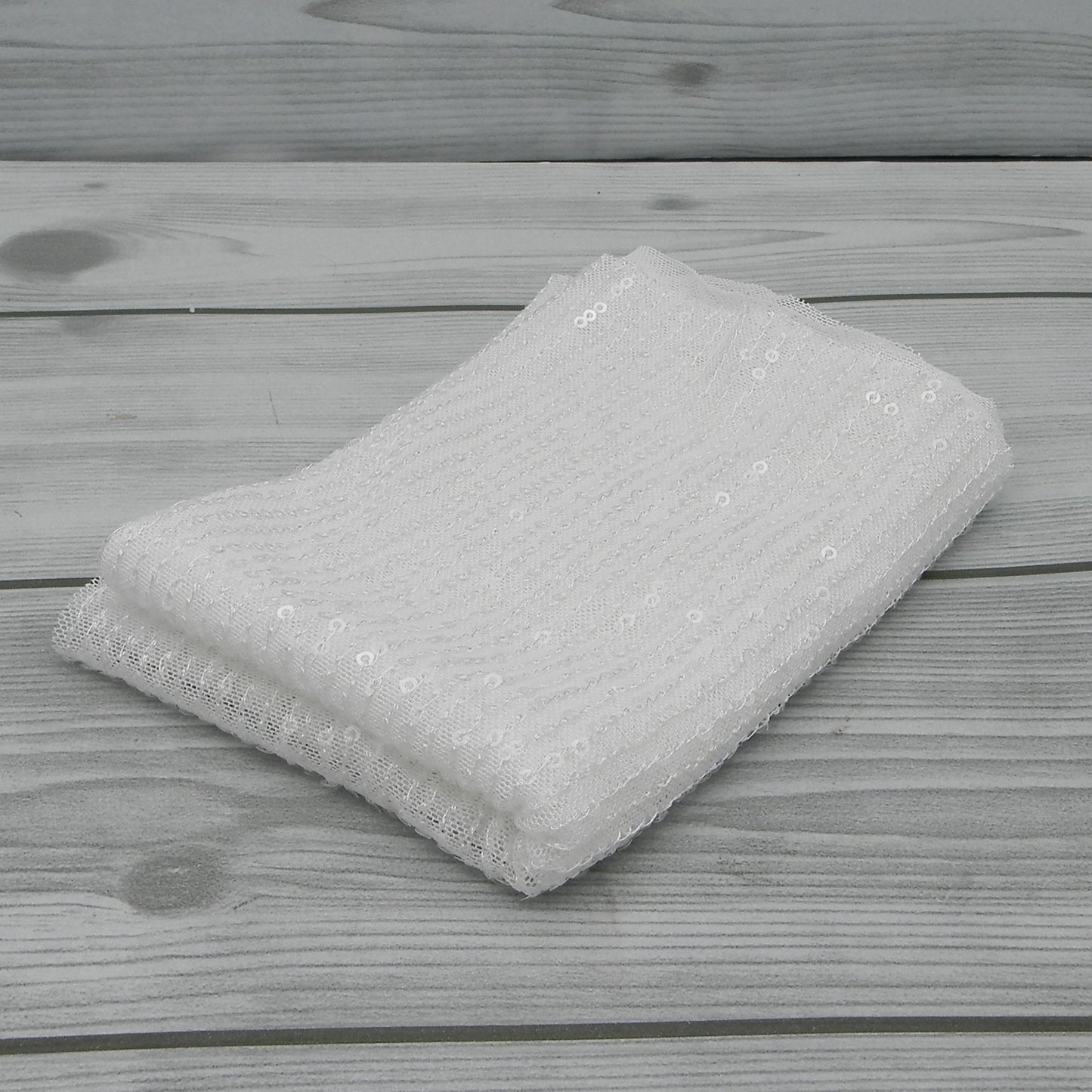 Tissu à paillettes dorées