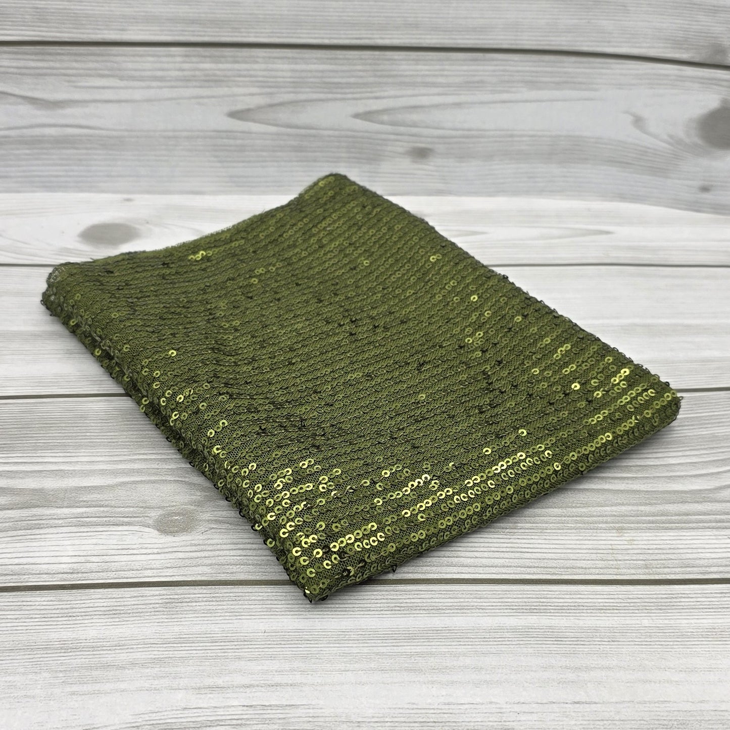 Tissu à paillettes dorées