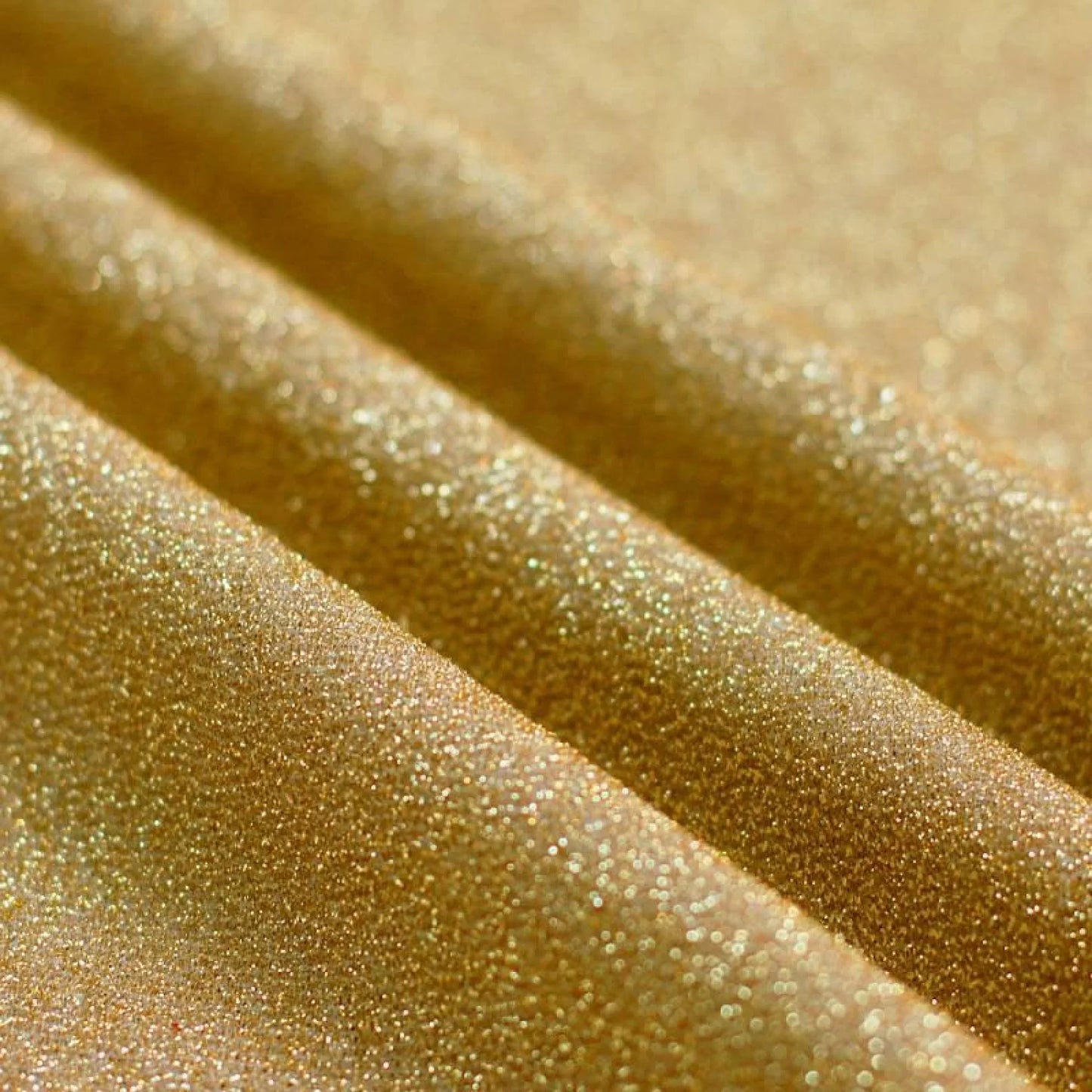Tessuto Glitteroso Oro Chiaro Gogolandia