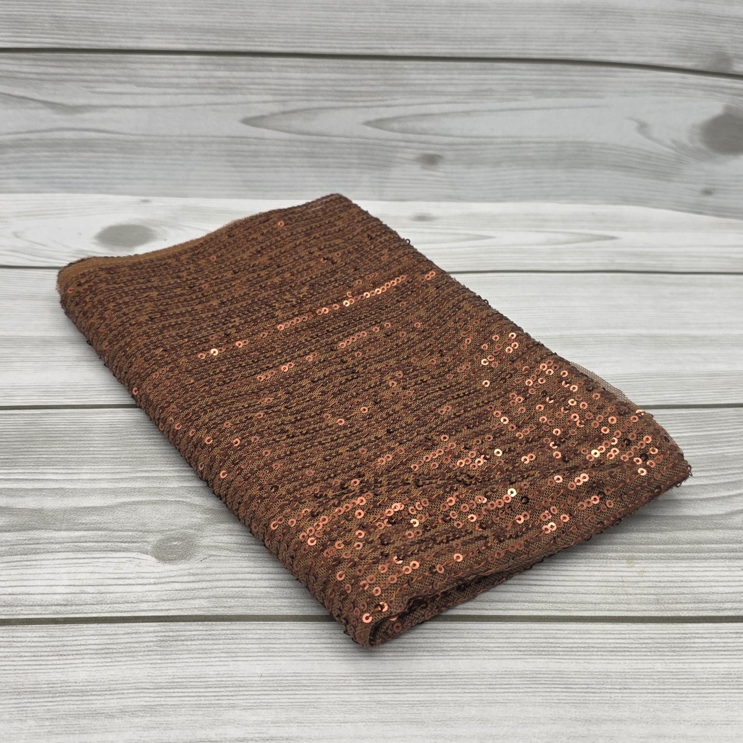 Tissu à paillettes dorées